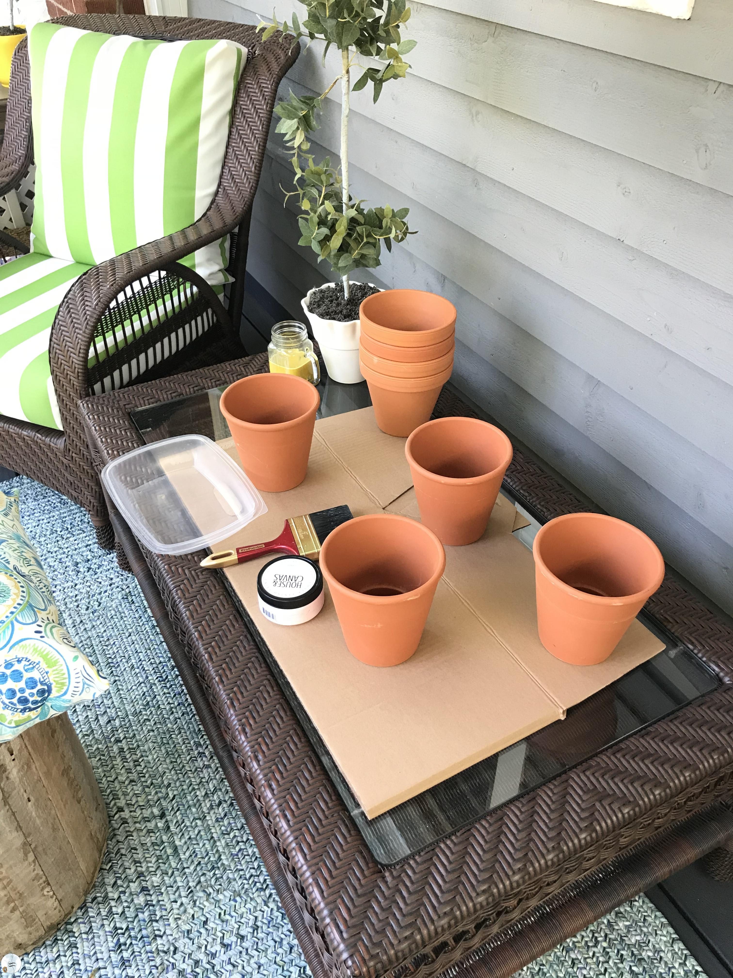 Super easy DIY project. Aged flower pots with house numbers. Great summer time project