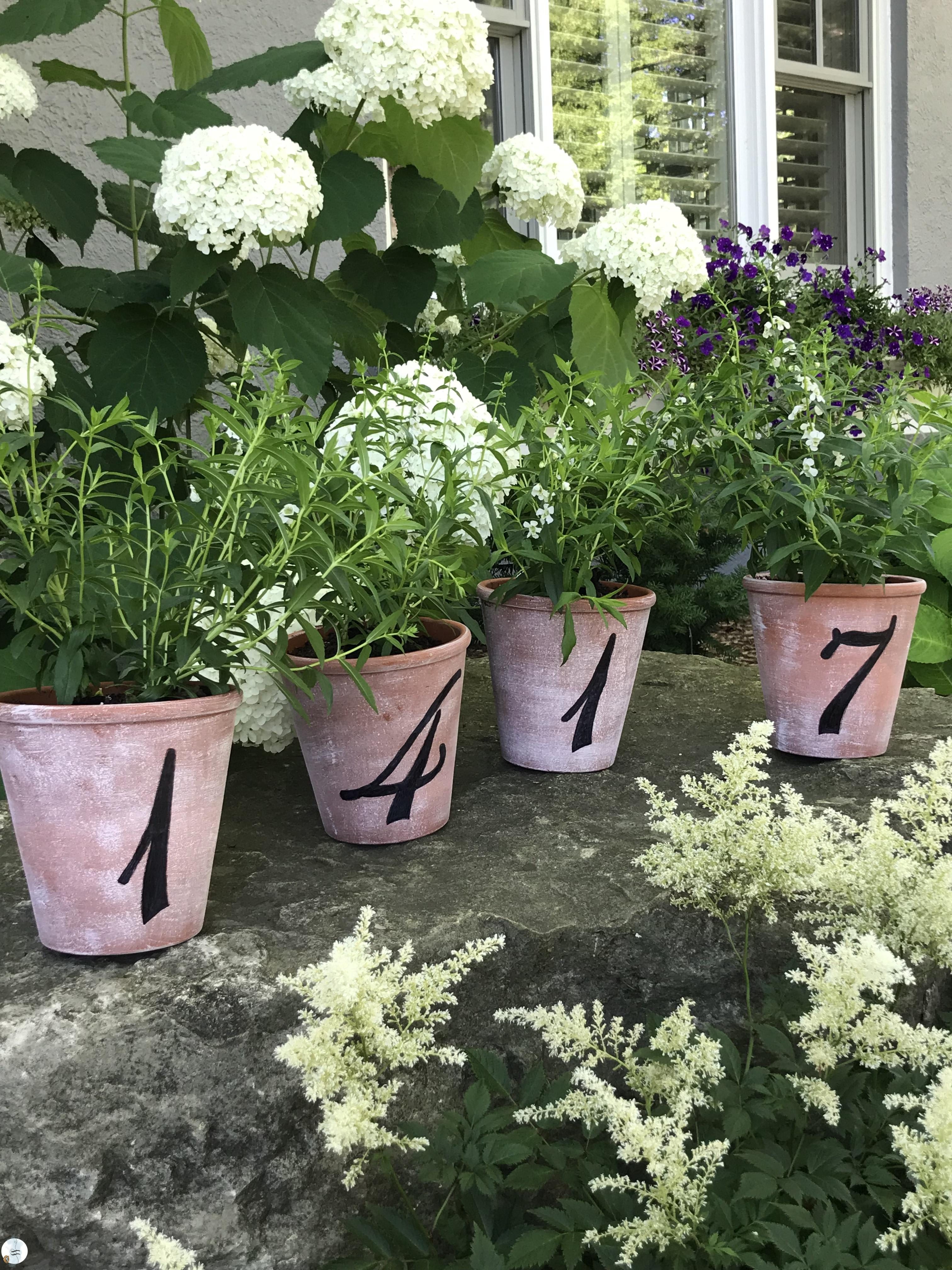 Perfect to give for mother's day or house warming...or just keep them for yourself. Aged flower pots with house numbers painted on them.