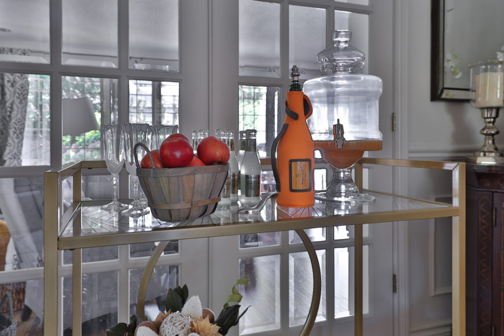 fall themed bar cart using champagne, apples and popcorn